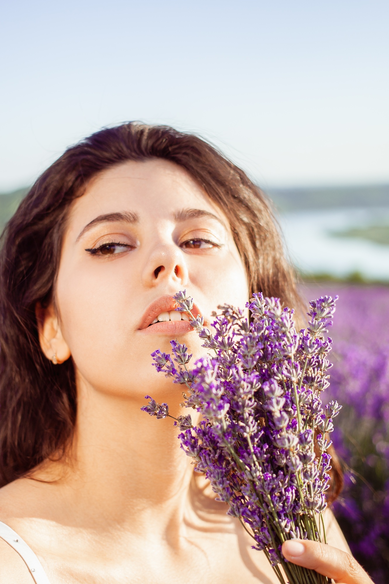 A beautiful girl in a lavender field. Beauty, beautiful makeup